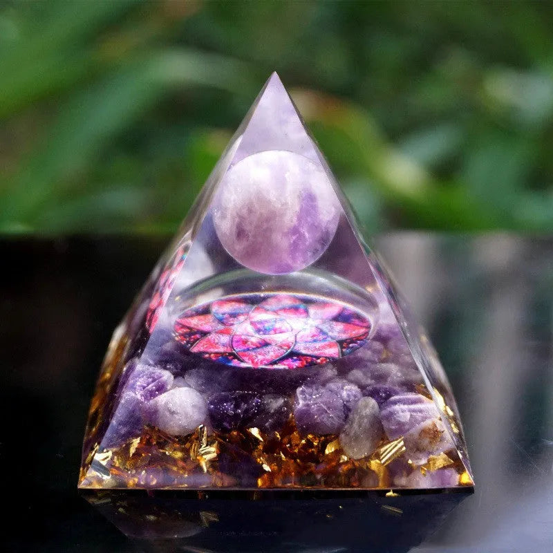 Small 6cm clear epoxy resin pyramid ornament with embedded pieces of natural coloured crystal gravel.