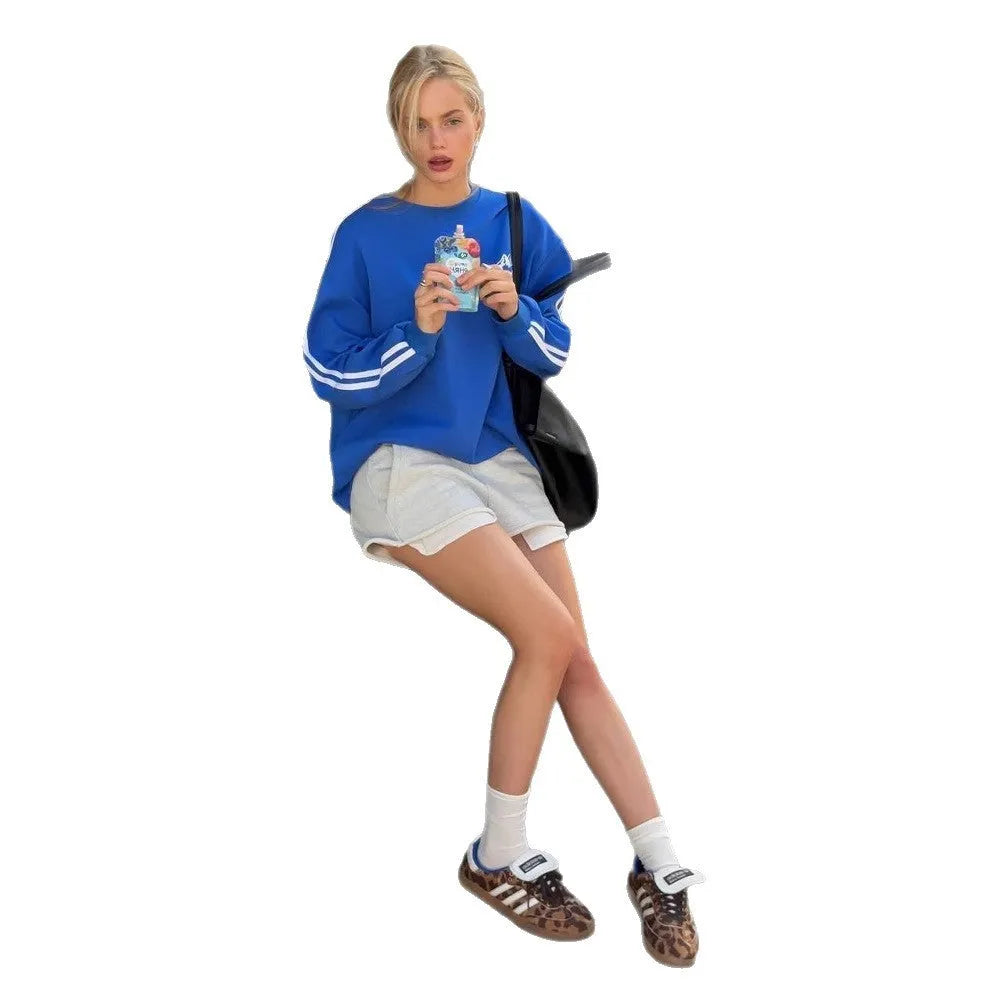 A blue and white vintage stripe cotton pullover sweater with long sleeves and a round neck.
