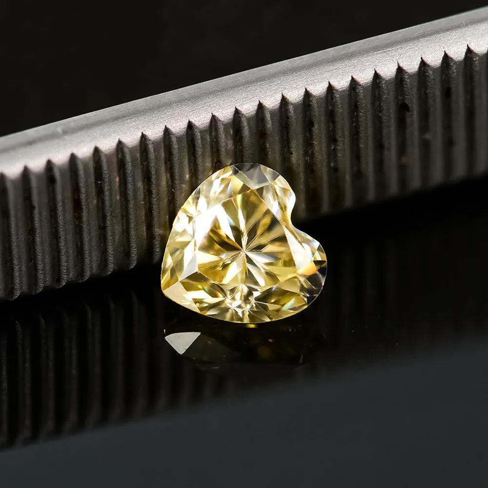 Heart-shaped moissanite loose stone in lemon yellow colour showing six size options