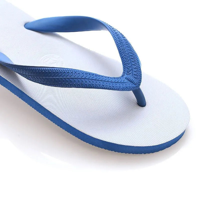 Rubber beach flip-flops with fish label in green, red, blue, or black, showing non-slip patterned sole.