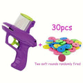 Interactive cat toy launcher with foam disc, available in green and purple colours