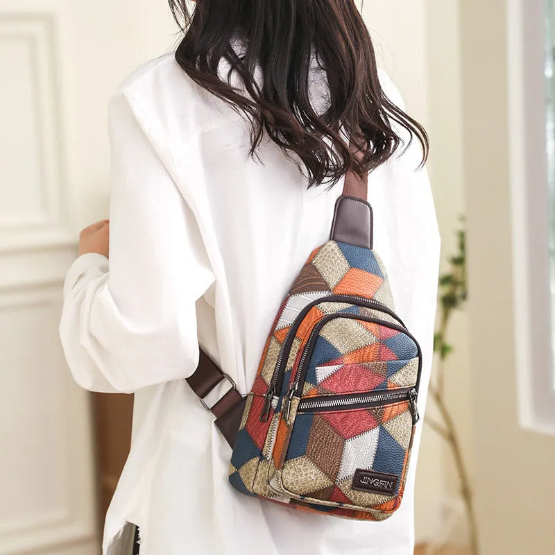 Color block PU leather crossbody bag with three-dimensional outer pocket and visible stitching detail