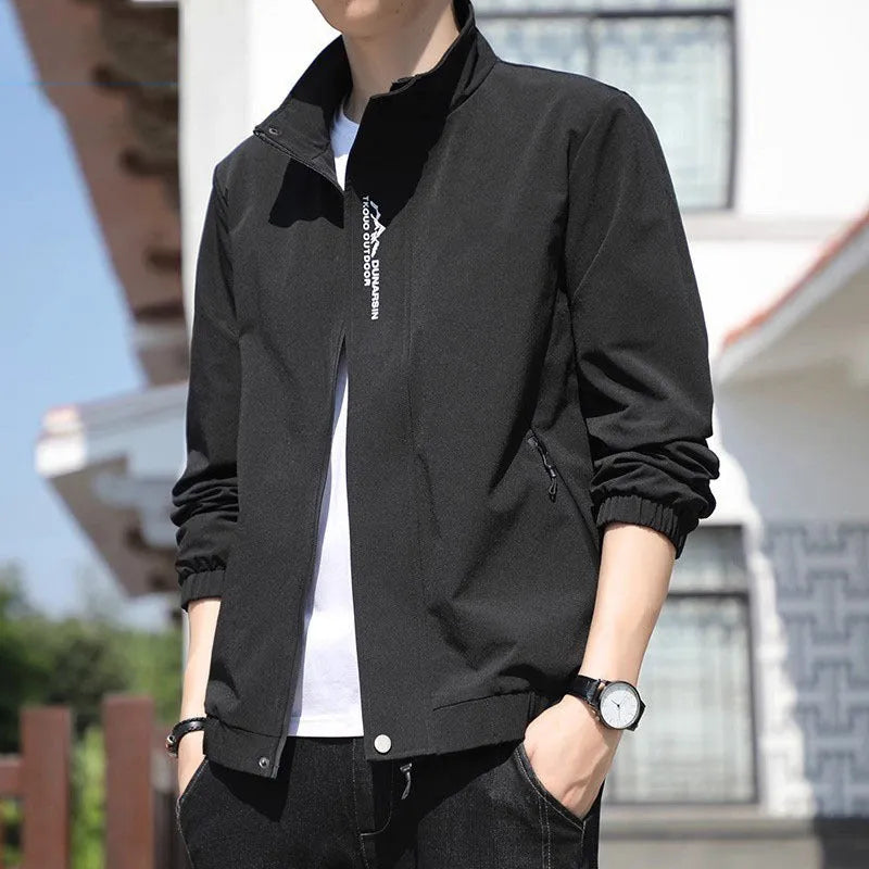 Men's black stand collar casual sports coat made from polyester fabric on a hanger.