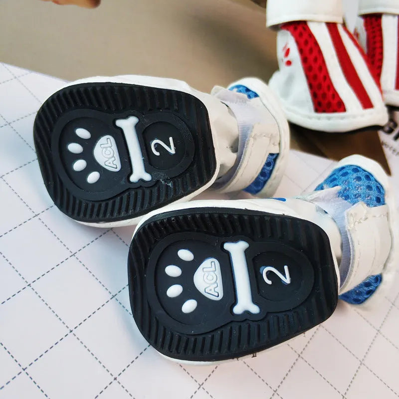 Blue cloth dog sneakers with side zipper closure, part of a set of four non-slip pet shoes