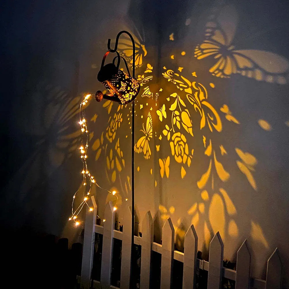Tapered butterfly pattern solar garden lamp in warm white iron for outdoor decoration.