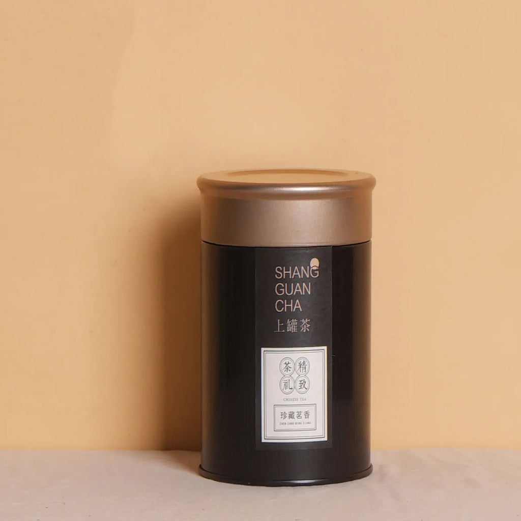Green tin can tea storage container with sealed lid showing 150ml capacity measurements