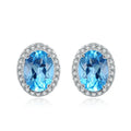 925 sterling silver jewellery set with blue topaz stones showing earrings, ring, pendant and necklace in geometric design