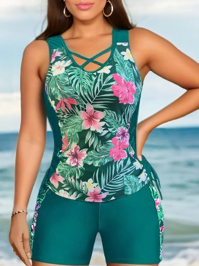 Women's plus size floral print high-waist swimsuit bikini in blue on a mannequin.