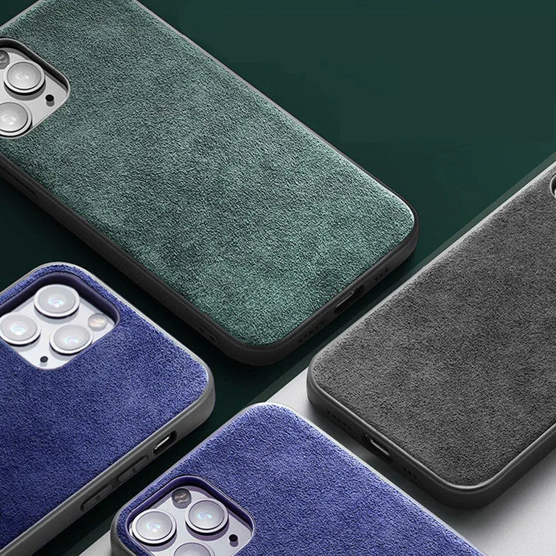 Suede luxury back case for iPhone on a dark background, shown in elegant black, dark night green, and dark blue colours.