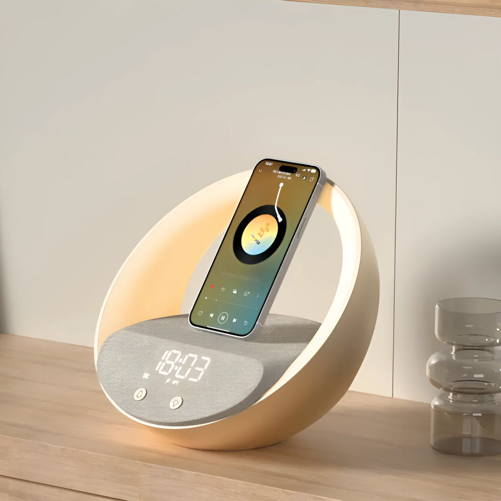 Beige wireless charging pad with digital clock, Bluetooth speaker, and ring of RGB LED mood lights.