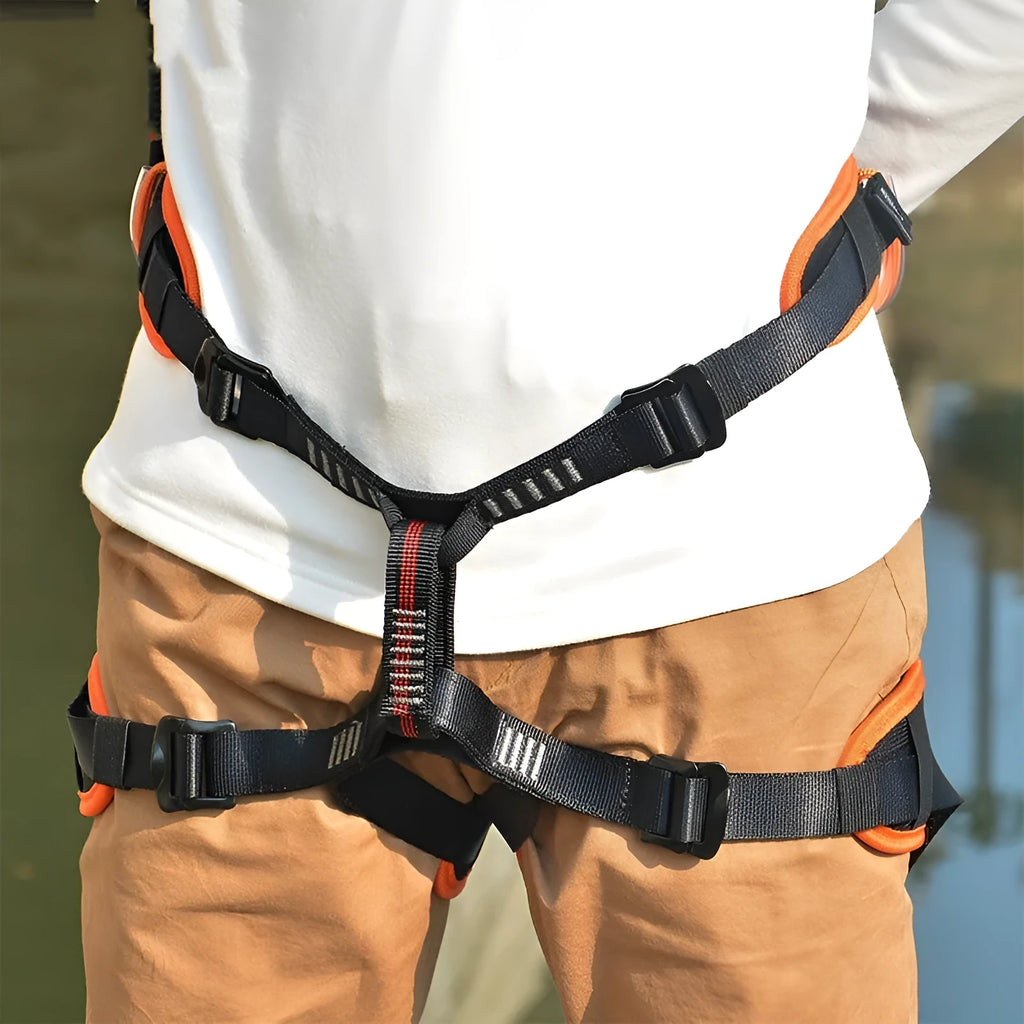 Outdoor mountaineering half seat belt in orange with adjustable waist and leg straps
