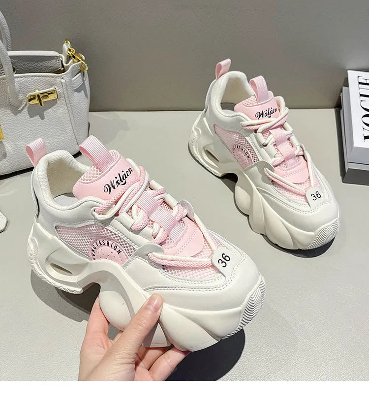 Women's casual sneakers in beige with cross straps, thick sole, and mesh lining.