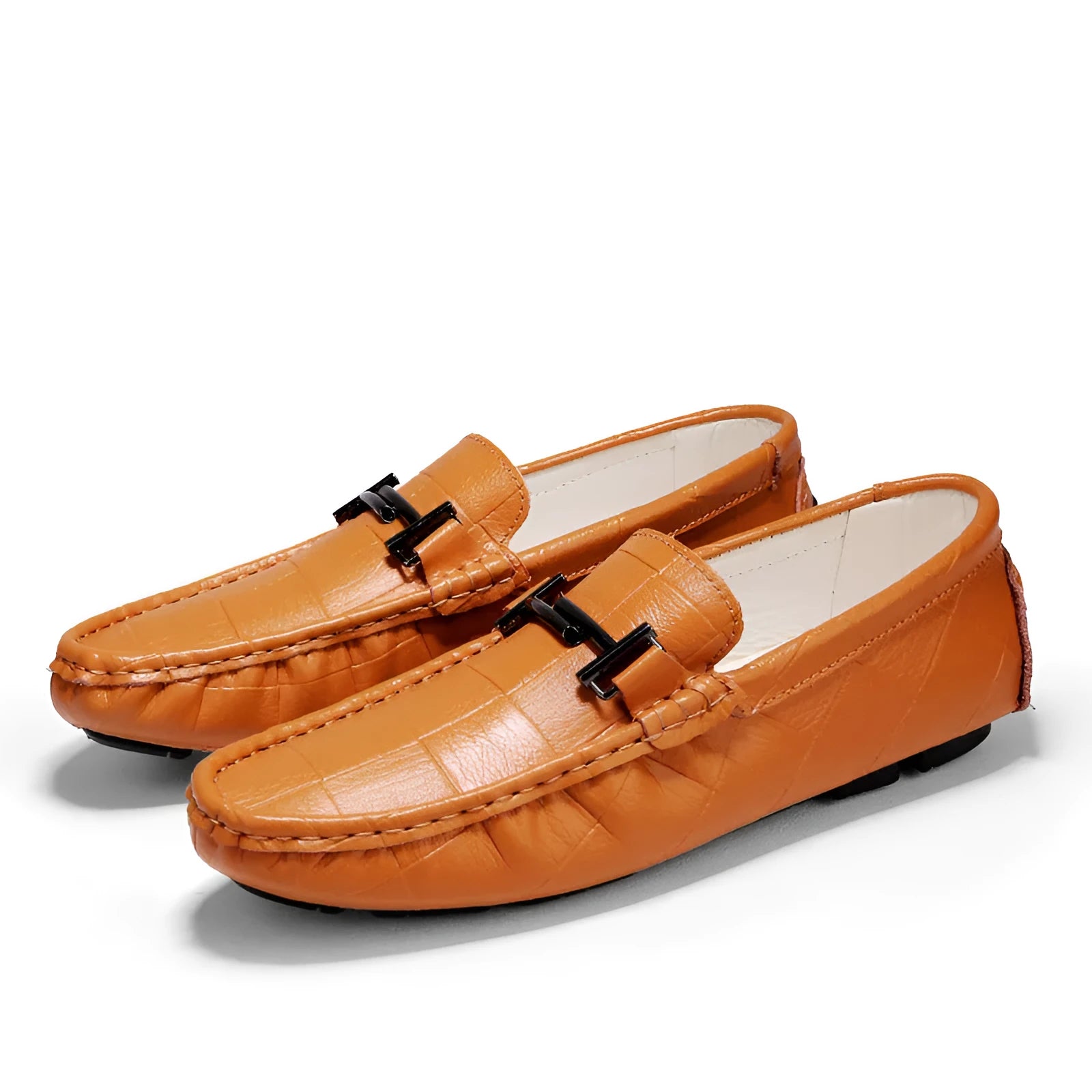 Men's black casual leather shoes with a silver buckle strap on a flat rubber sole.