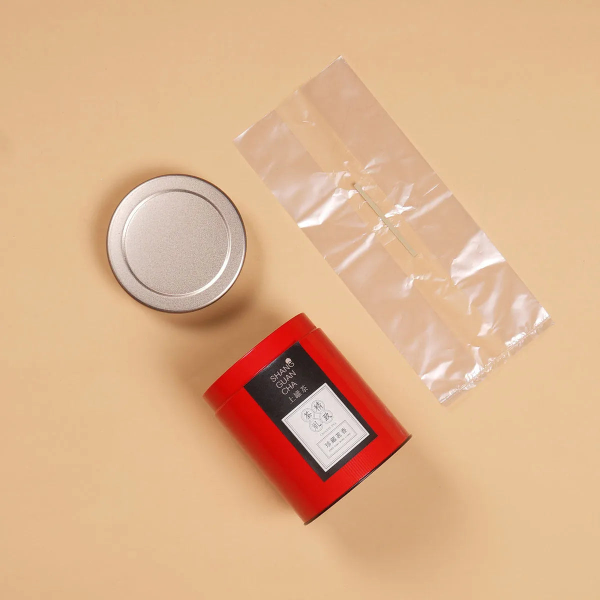 Green tin can tea storage container with sealed lid showing 150ml capacity measurements