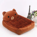 A blue cartoon-style pet sofa bed with raised sides for a small dog, showcasing its washable cover and non-slip base.