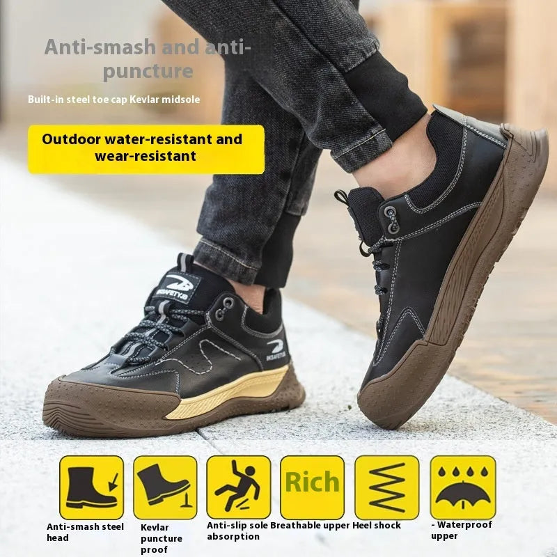 Men's black leather work safety shoes with rubber soles on a grey background