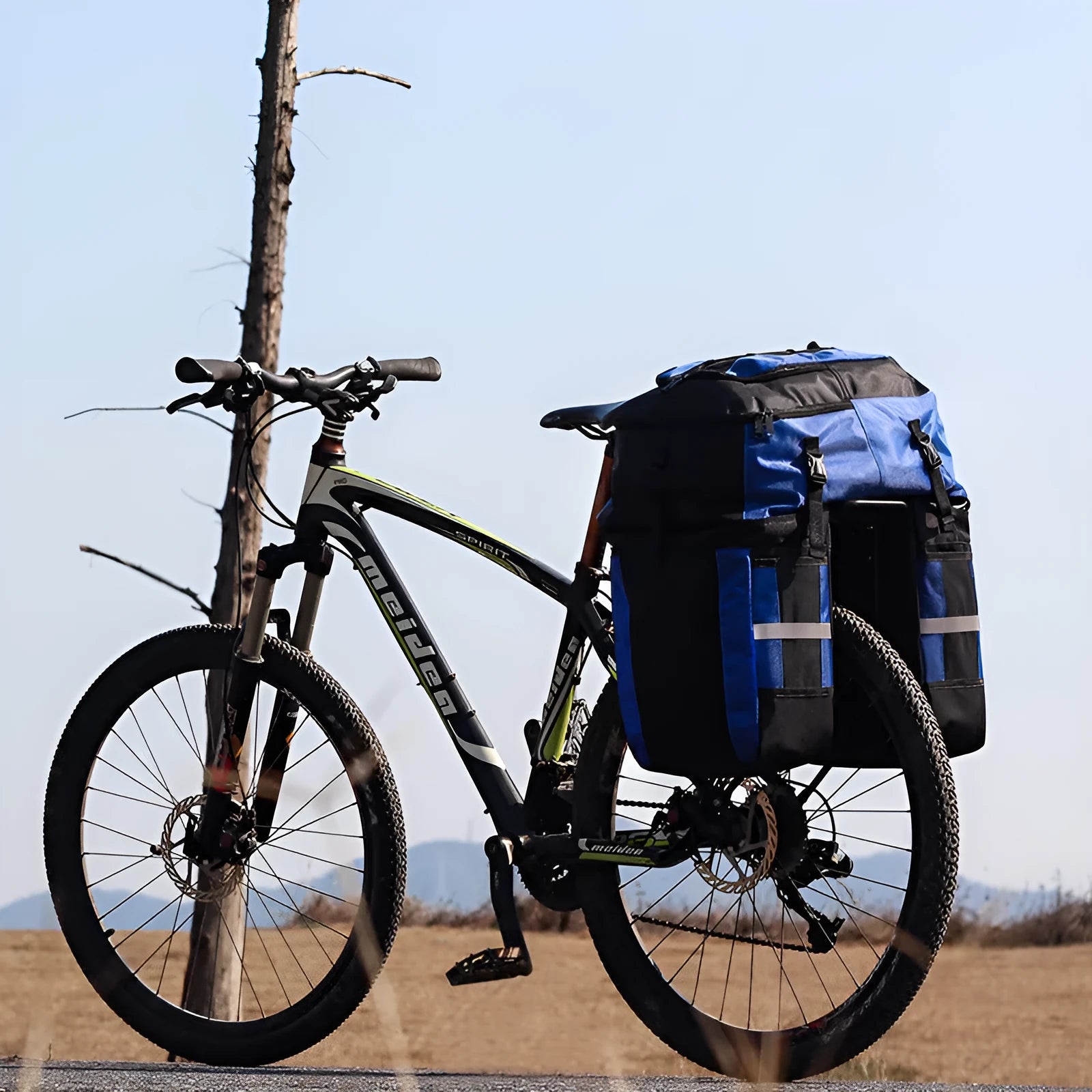 Rhinoceros bicycle rear storage bag with 70L capacity in green colour mounted on bicycle frame