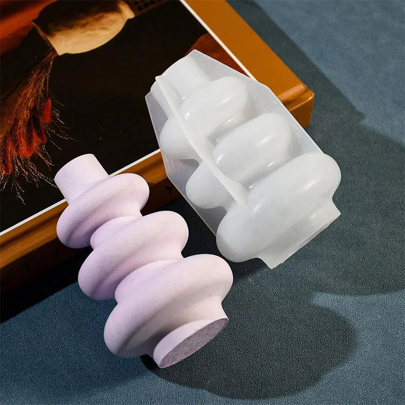 Silicone mould for making three-layer circular vase ornament cakes in modern irregular shape.