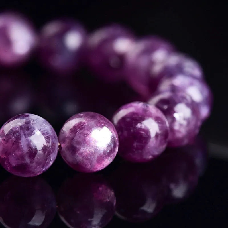 Grandmother polished crystal bracelet in geometric design showing pink purple 5A grade beads.