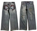 Grey washed-out wide-leg men's jeans with a straight cut and mid-waist design on a neutral background.