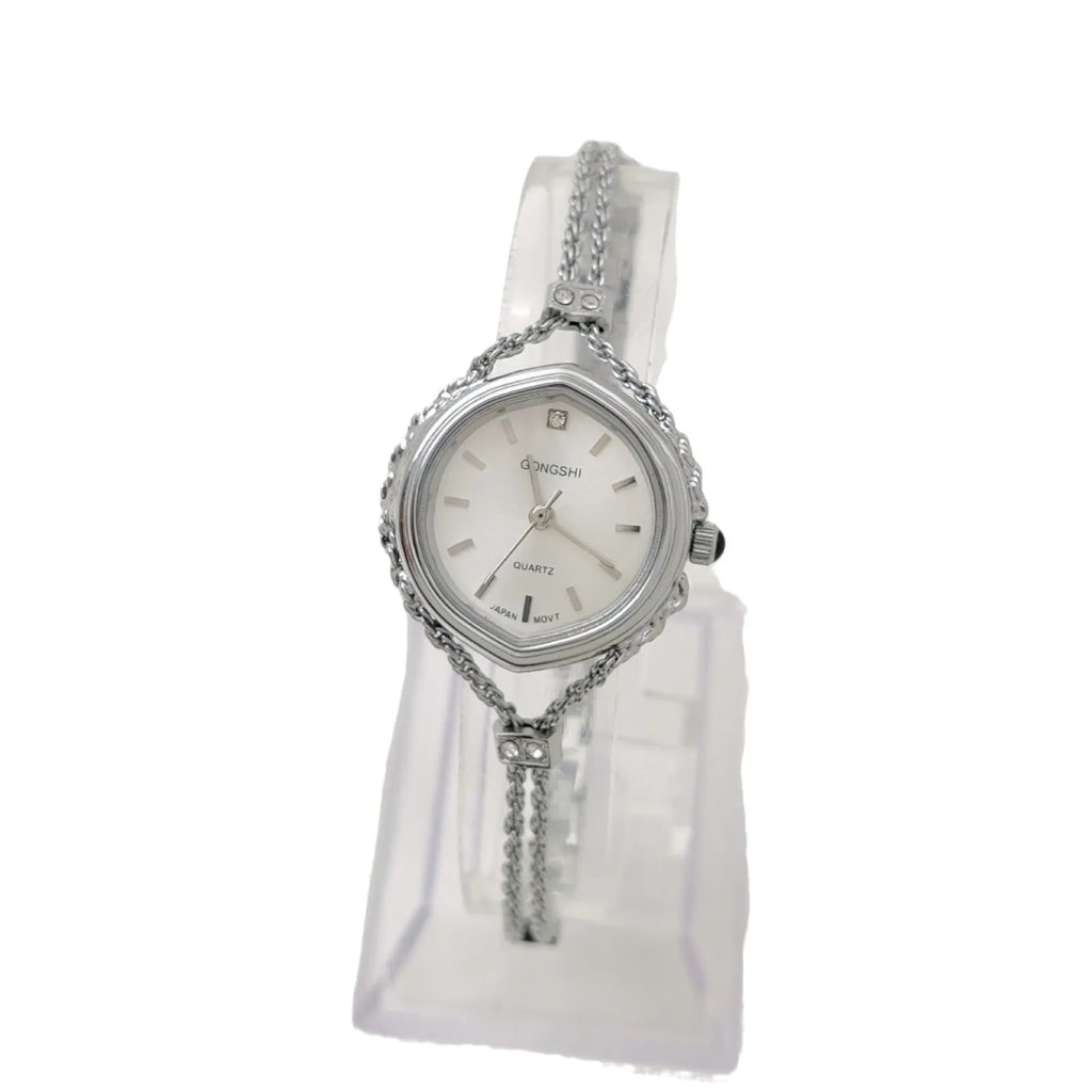 Gold or silver Mori-style women's quartz watch with a 25mm dial and metal chain strap.