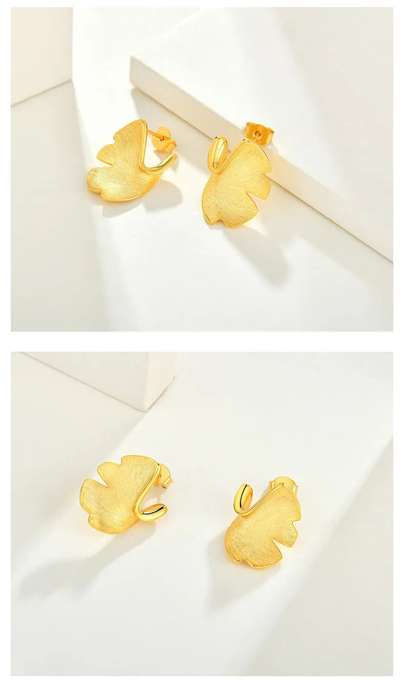 925 sterling silver stud earrings with 14k gold plated ginkgo biloba leaf design in gold colour