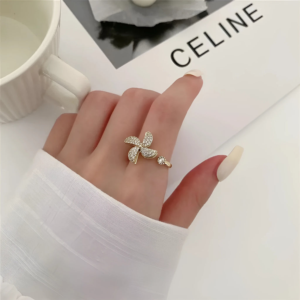 Copper rotating ring with spinning windmill design in gold or silver finish