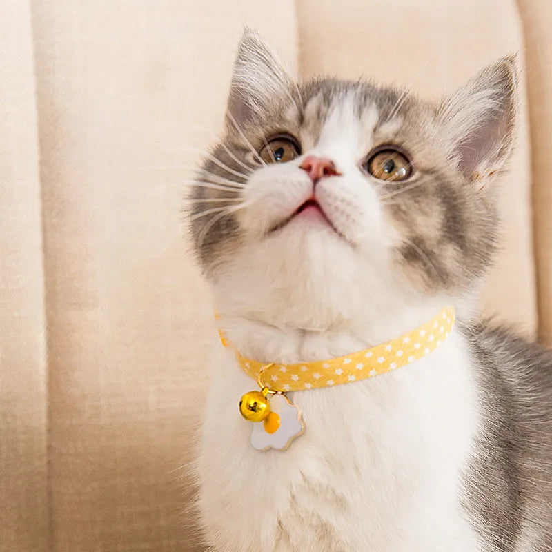 Adjustable pet collar with metal bell pendant and fabric bow tie decoration in choice of colours