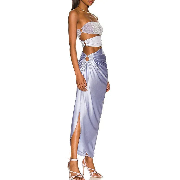 Purple women's one-piece swimsuit with hollow design and matching wrap skirt on mannequin