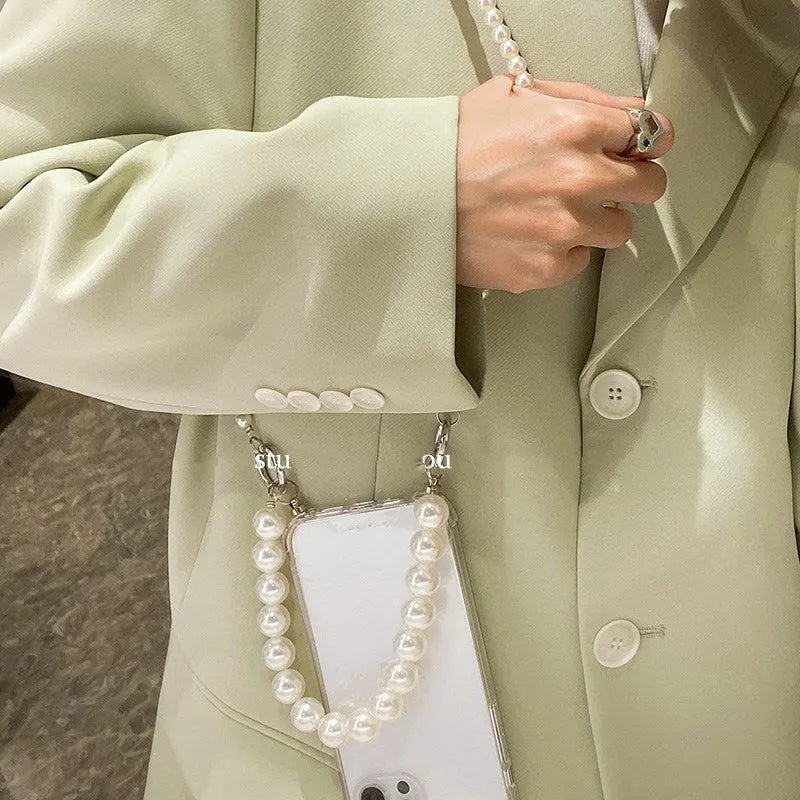 Soft mobile phone case with a white pearl charm chain attached, shown in a selected colour.