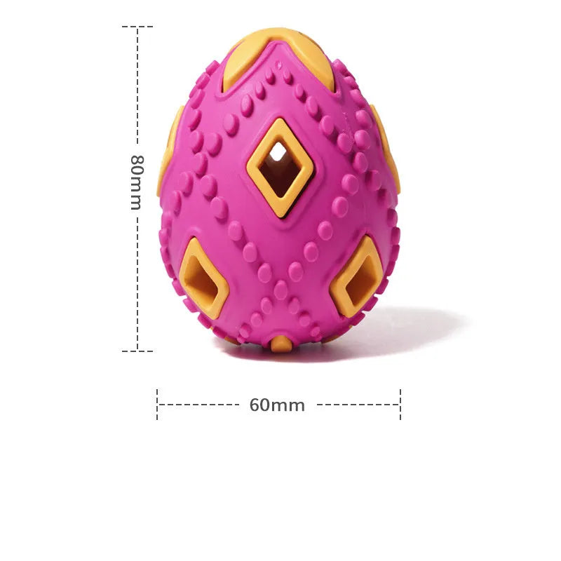 Egg-shaped puppy teething chew toy with hollow treat centre, ragged surface, purple or red, for small dogs.