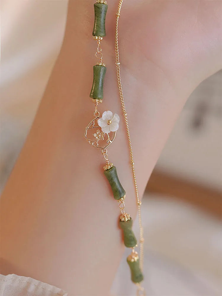 Natural olivine double layer bracelet with braided cord and Bells of Ireland design