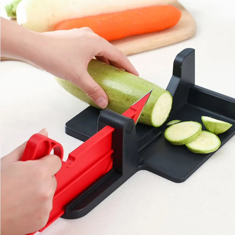Green kitchen vegetable cutter with stainless steel blades for cutting carrots and potatoes