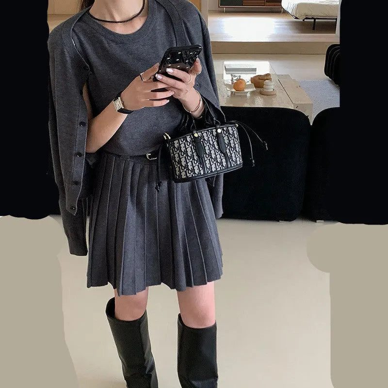Grey art retro knitted vest skirt and long-sleeved cardigan two-piece set for women.