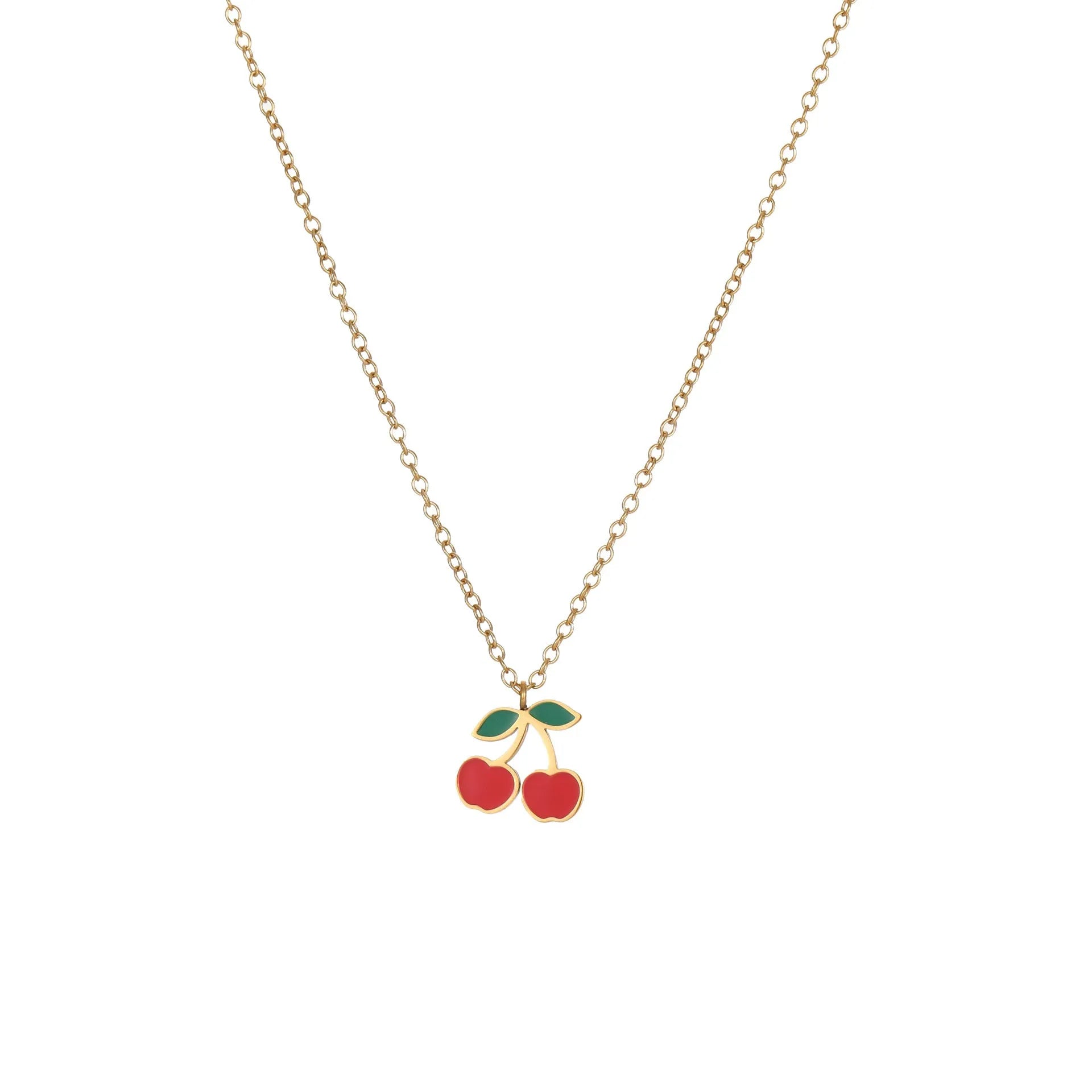 Cherry design jewellery set with gold plated necklace, bracelet, earrings, and ring on a flat surface.