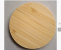 Square wooden bamboo 5W wireless charging pad for smartphones on a desk