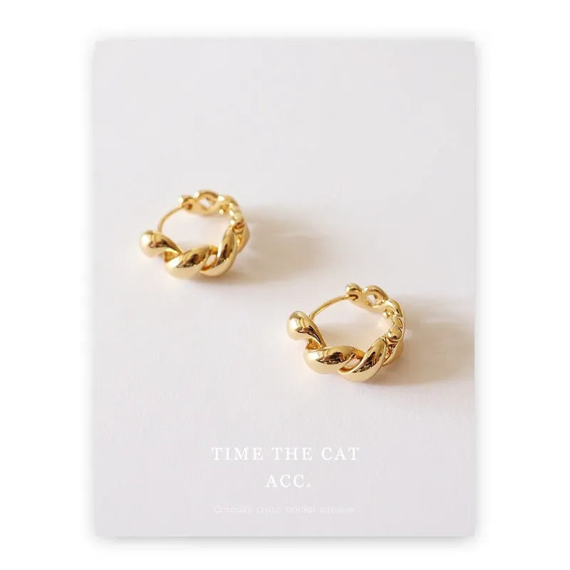 Pair of retro geometric round copper earrings with electroplated 18K gold or white gold finish for women.