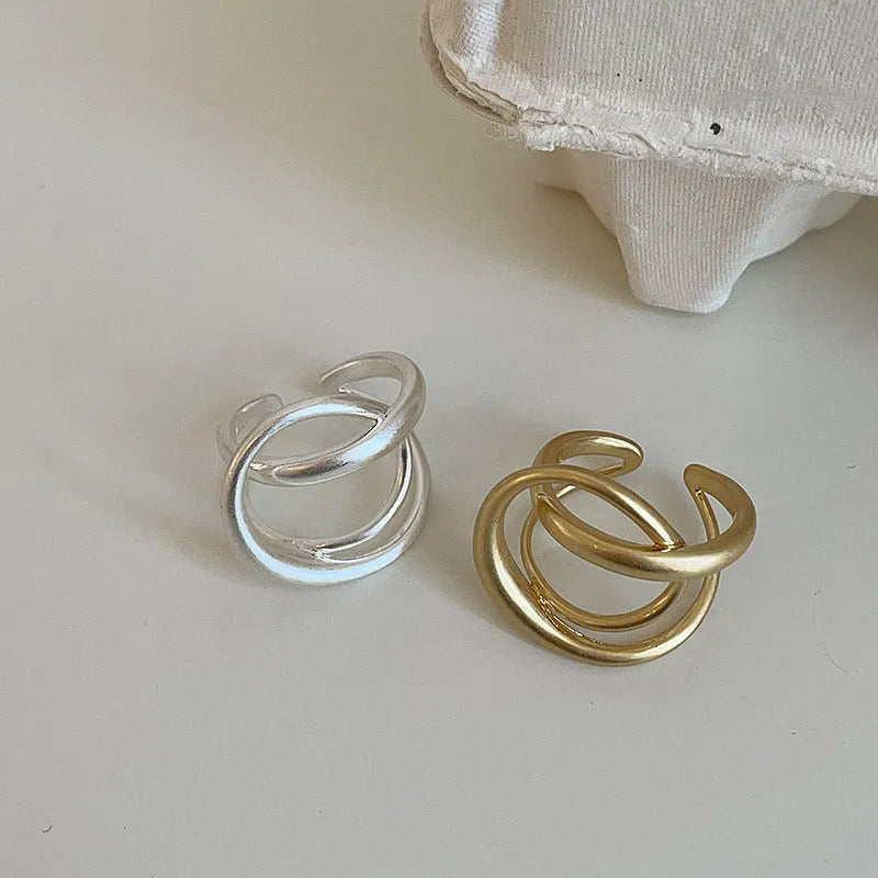 Three-dimensional interlaced geometric adjustable ring with matte metal finish and real gold electroplating
