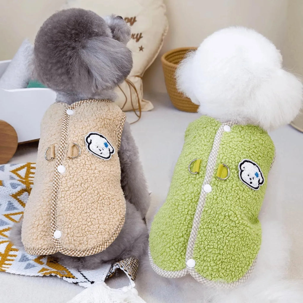 Green coral fleece dog vest with leash ring on a small dog, showing winter outfit.