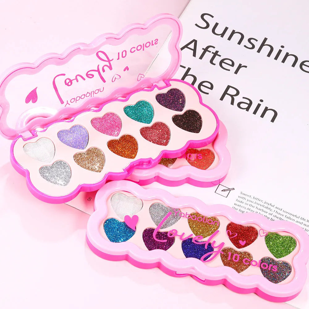Pearlescent heart-shaped ten-colour sequin eye shadow palette showing shades of pink, blue, purple and brown.