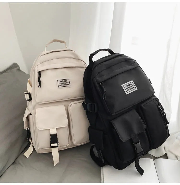 Soft nylon student backpack in black colour with computer compartment and three-dimensional pockets