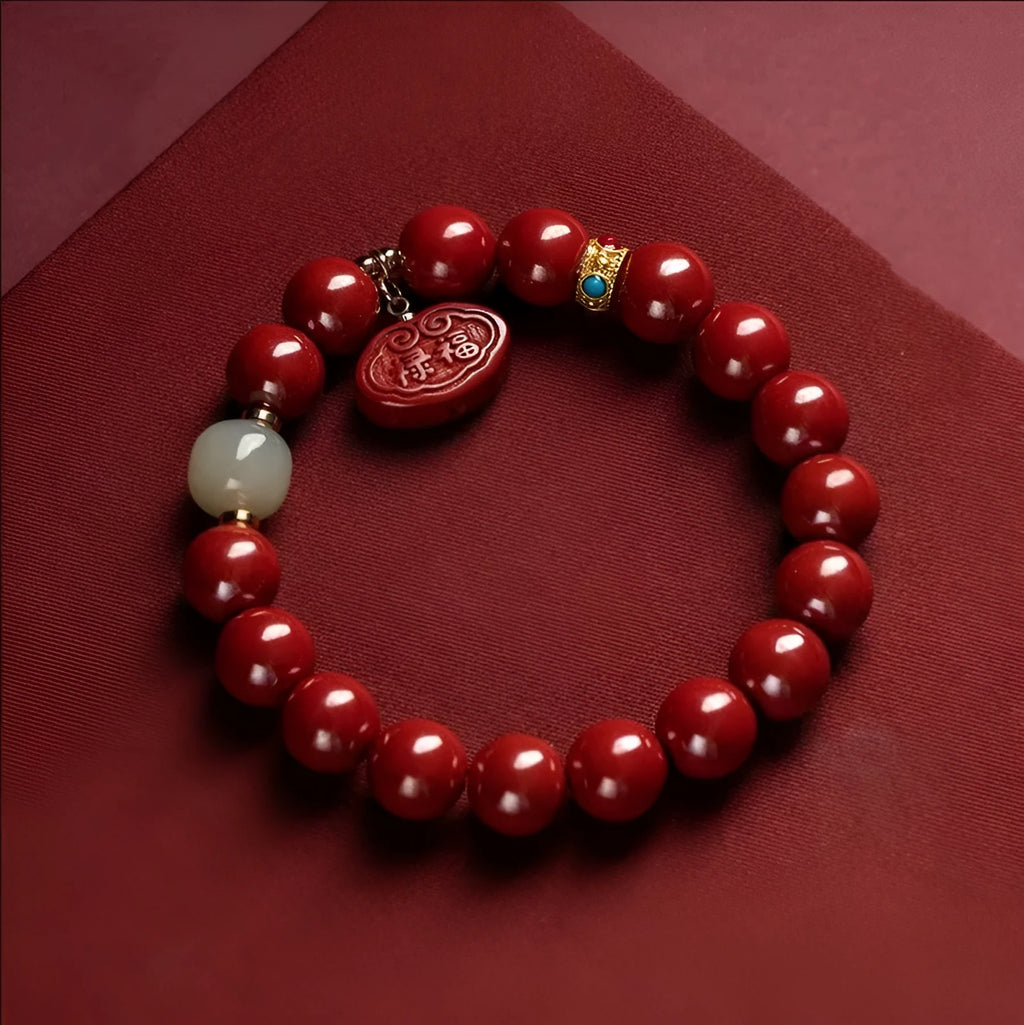 Red cinnabar Emperor Sandstone Ping An Fu Lu adjustable bracelet on wrist.