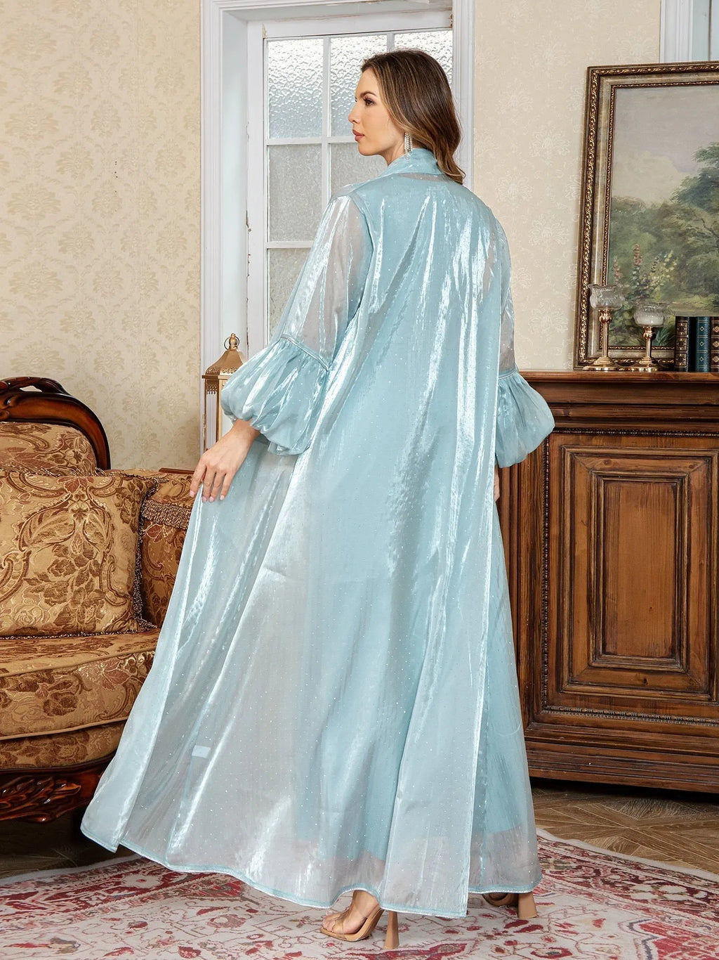Dubai-inspired two-piece Arabic evening dress in blue with rhinestone detailing and long sleeves