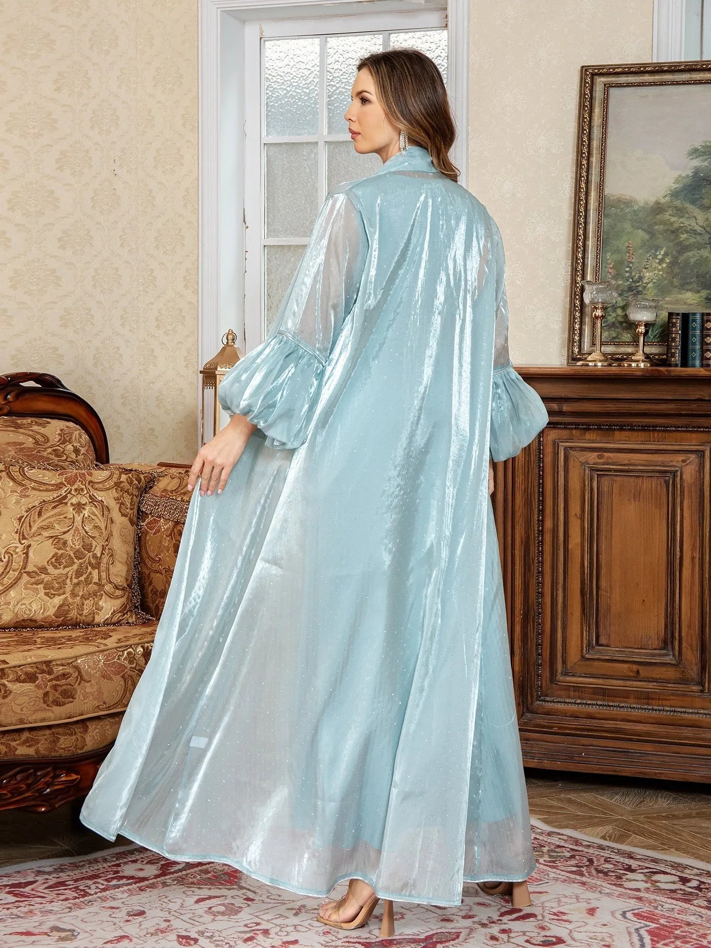 Dubai-inspired two-piece Arabic evening dress in blue with rhinestone detailing and long sleeves