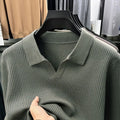 Man wearing a loose fit green casual pullover sweater, autumn casual style