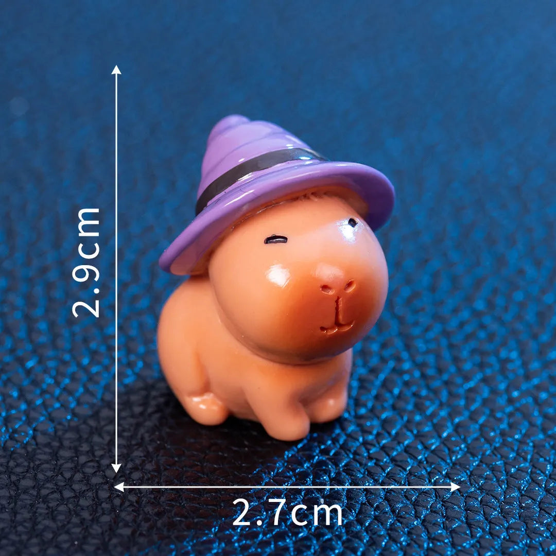 Eight different Halloween-themed capybara resin figurines displayed together