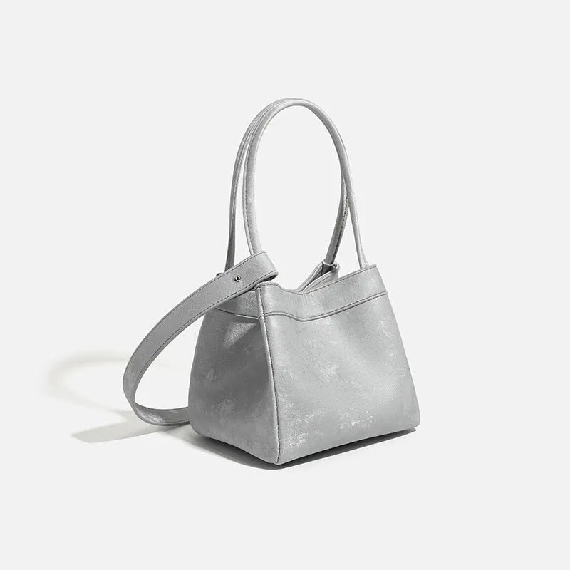 PU leather shoulder crossbody bag with single strap, tassel, open pocket, and sewing thread detail