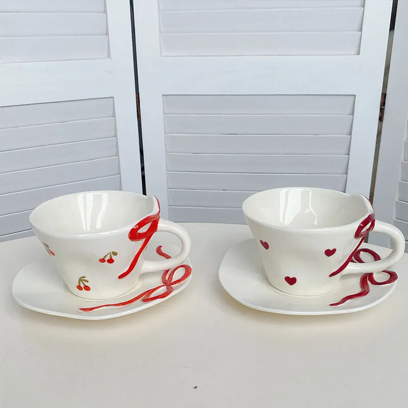 Hand painted white porcelain coffee cup with cherry design and matching coaster