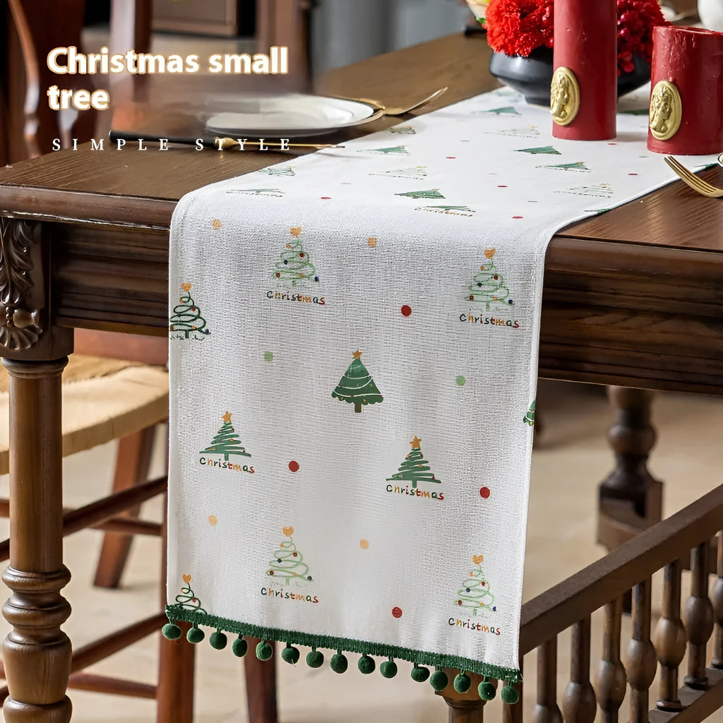 Green Christmas table runner with tree pattern on a dining table, 35cm wide polyester imitation linen