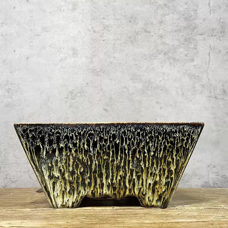 Yellow ceramic flower basin planter on a tabletop, suitable for indoor or outdoor use with small plants